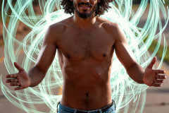 Photos of Handsome Shirtless Men Dancing with Light Rays,Colorful,in Motion.