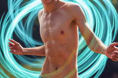 Photos of Handsome Shirtless Men Dancing with Light Rays,Colorful,in Motion.