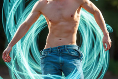 Photos of Handsome Shirtless Men Dancing with Light Rays,Colorful,in Motion.