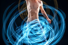 Photos of Handsome Shirtless Men Dancing with Light Rays,Colorful,in Motion.