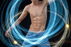 Photos of Handsome Shirtless Men Dancing with Light Rays,Colorful,in Motion.