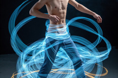 Photos of Handsome Shirtless Men Dancing with Light Rays,Colorful,in Motion.