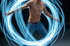 Photos of Handsome Shirtless Men Dancing with Light Rays,Colorful,in Motion.