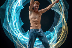 Photos of Handsome Shirtless Men Dancing with Light Rays,Colorful,in Motion.
