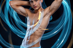 Photos of Handsome Shirtless Men Dancing with Light Rays,Colorful,in Motion.