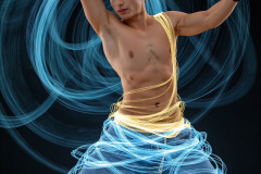 Photos of Handsome Shirtless Men Dancing with Light Rays,Colorful,in Motion.