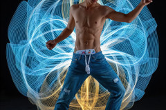 Photos of Handsome Shirtless Men Dancing with Light Rays,Colorful,in Motion.
