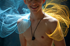 Photos of Handsome Shirtless Men Dancing with Light Rays,Colorful,in Motion.