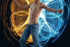 Photos of Handsome Shirtless Men Dancing with Light Rays,Colorful,in Motion.