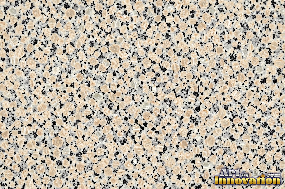 Polished granite with dense speckles of mineral crystals in warm beige