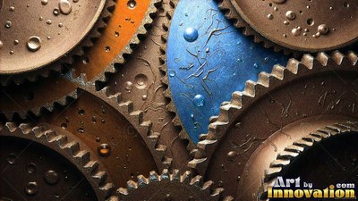 Interlocking bronze gears fit together around bright blue metal with droplets