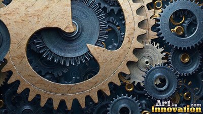 A large notched brass gear overlaps steel clockwork wheels in soft light