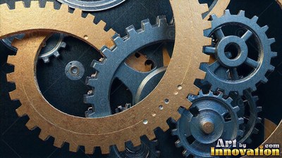 Gold and blue metallic gears fit together closely in the dark
