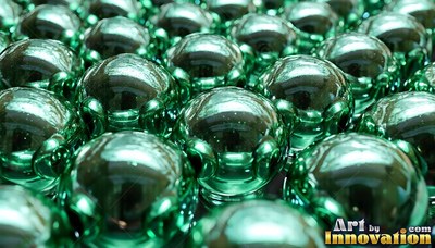 Shiny green ball bearings arranged in close rows