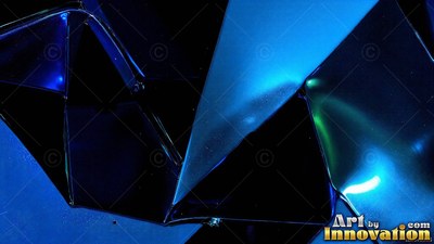 In a dark area, folded geometric planes catch blue and green light