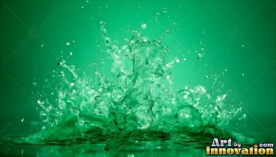Spraying upward in bright light, clear water splashes against green