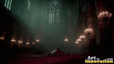 Sitting under dim chandeliers, a dark cathedral floor holds a small pile of red cloth