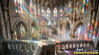 Sunlight shines through stained glass into a misty cathedral with stone walls with chandeliers