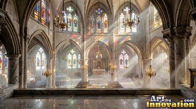 Sunlight streams through tall stained glass into a misty tall stone cathedral interior
