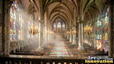 Viewed from above, light cuts through mist down the aisle of a cathedral
