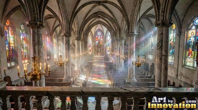 Cathedral interior with light streaming through stained glass panes