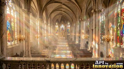 Beams of colored sunlight pour through windows into a stone cathedral hall with rows of wooden pews
