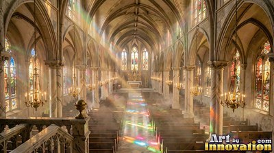 Arched stone ceilings rise over cathedral pews as sunbeams cast colored light on the aisle floor
