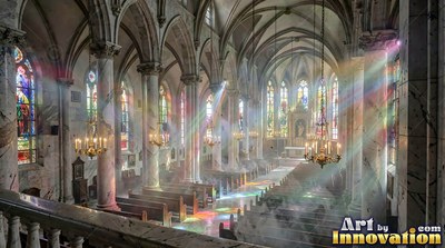 Cathedral interior with rainbow sunlight on empty wooden pews
