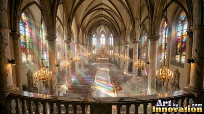 In a cathedral, colorful light beams across rows of wooden pews