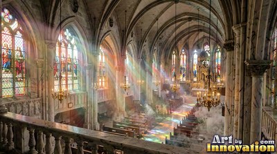 Cathedral with sunlight through stained-glass windows onto foggy pews