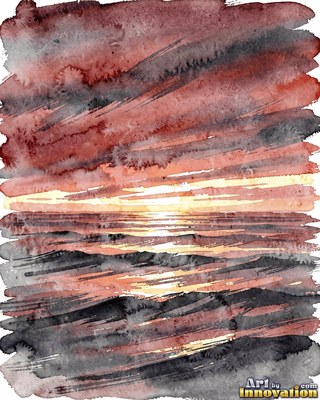 Calm ocean sunset with a long glowing reflection on the water