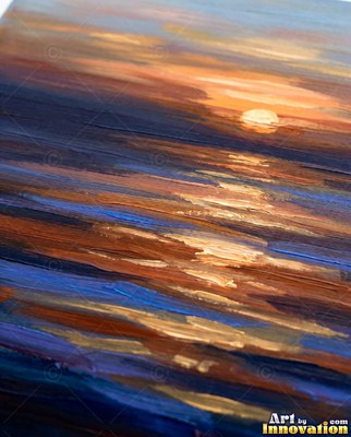 Stormy sea at sunset with scarlet light breaking through dark clouds