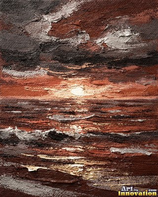 Calm ocean sunset with a long glowing reflection on the water