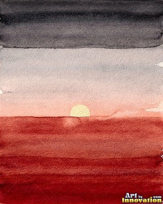 Desert dunes under a blazing sunset sky