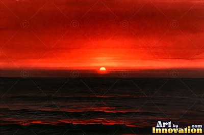 Lone tree silhouetted on a hilltop against a fiery sunset