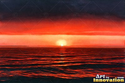 Calm ocean sunset with a long glowing reflection on the water