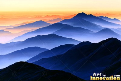 Desert dunes under a blazing sunset sky