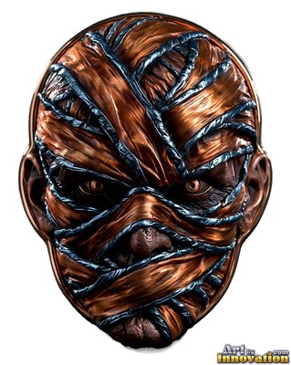 A copper mummy badge stares forward, covered in metallic bandages bound by dark blue cord