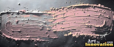 Thick ridges of pink cosmetic powder smeared across a dark slate surface under direct light