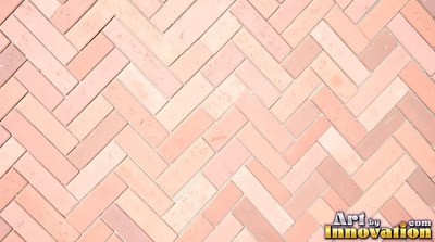 Salmon pink brick laid in a neat stack bond grid, soft even light across the wall