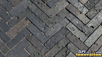 Weathered red brick wall with chipped corners and crumbling mortar, shot flat and evenly lit