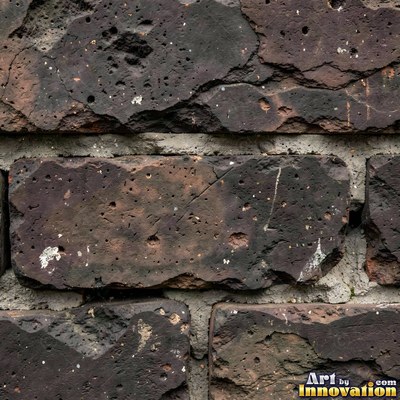 Salmon pink brick laid in a neat stack bond grid, soft even light across the wall