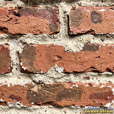 Salmon pink brick laid in a neat stack bond grid, soft even light across the wall