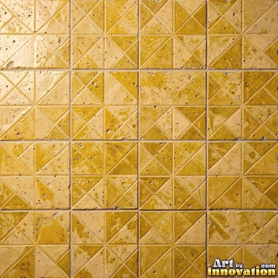 Old chipped yellow tiles with darkened grout lines filling the frame