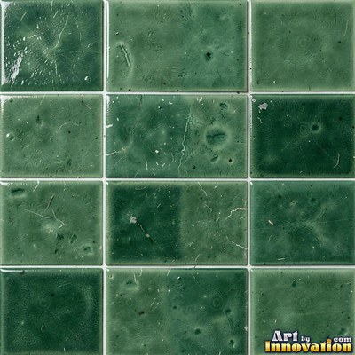 Matte sage green terracotta tiles with soft worn edges under even daylight