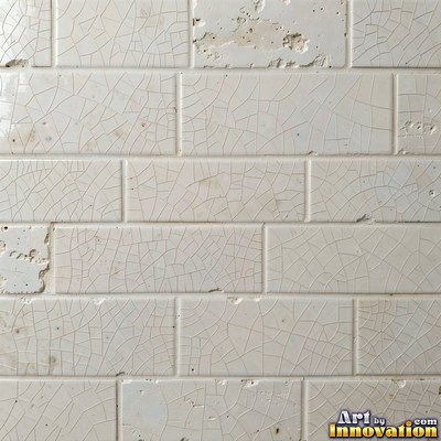 Old chipped yellow tiles with darkened grout lines filling the frame