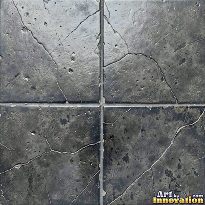 Old chipped yellow tiles with darkened grout lines filling the frame