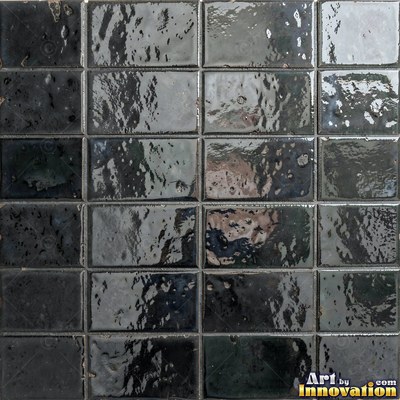 Charcoal glazed rectangular tiles laid in a herringbone pattern, flat front view