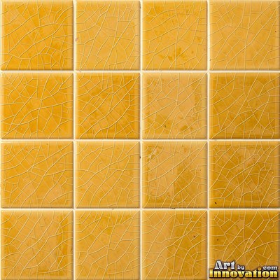 Old chipped yellow tiles with darkened grout lines filling the frame