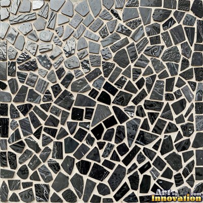 Broken tile mosaic of irregular yellow shards set in gray grout